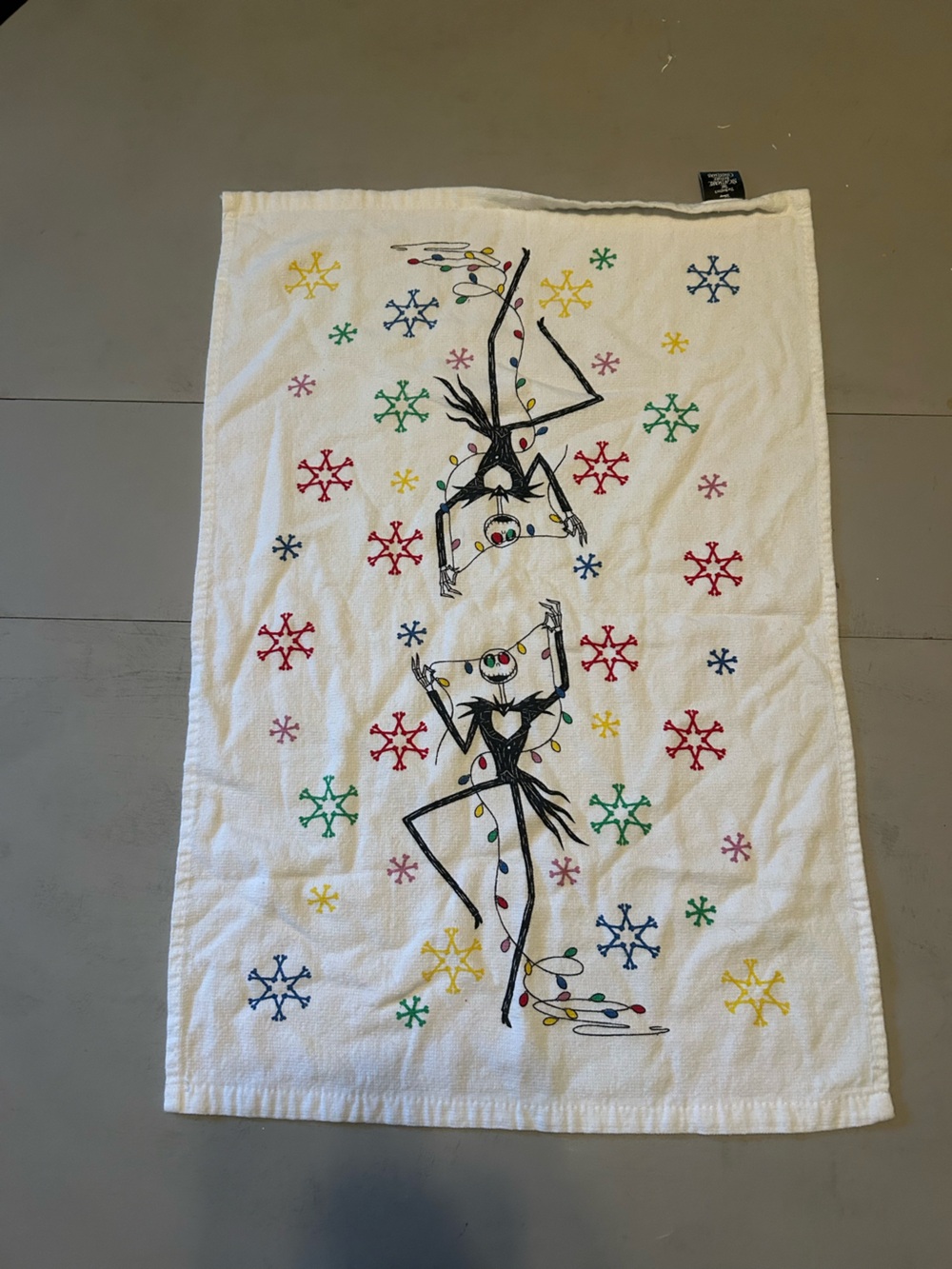 Disney White Jack Skellington Holiday kitchen Towel with Multicolor Snowflakes